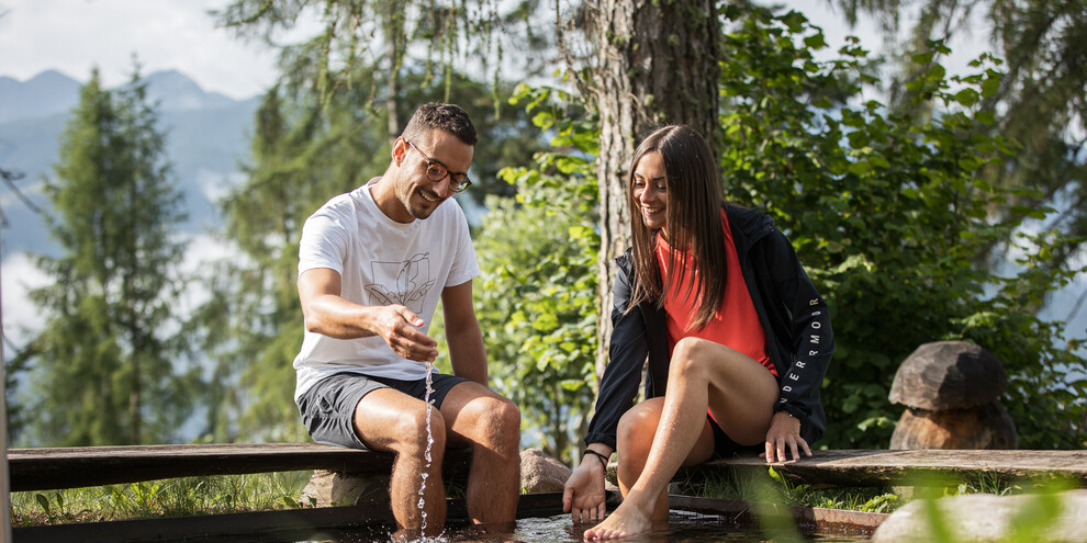 With bare feet in the cool water